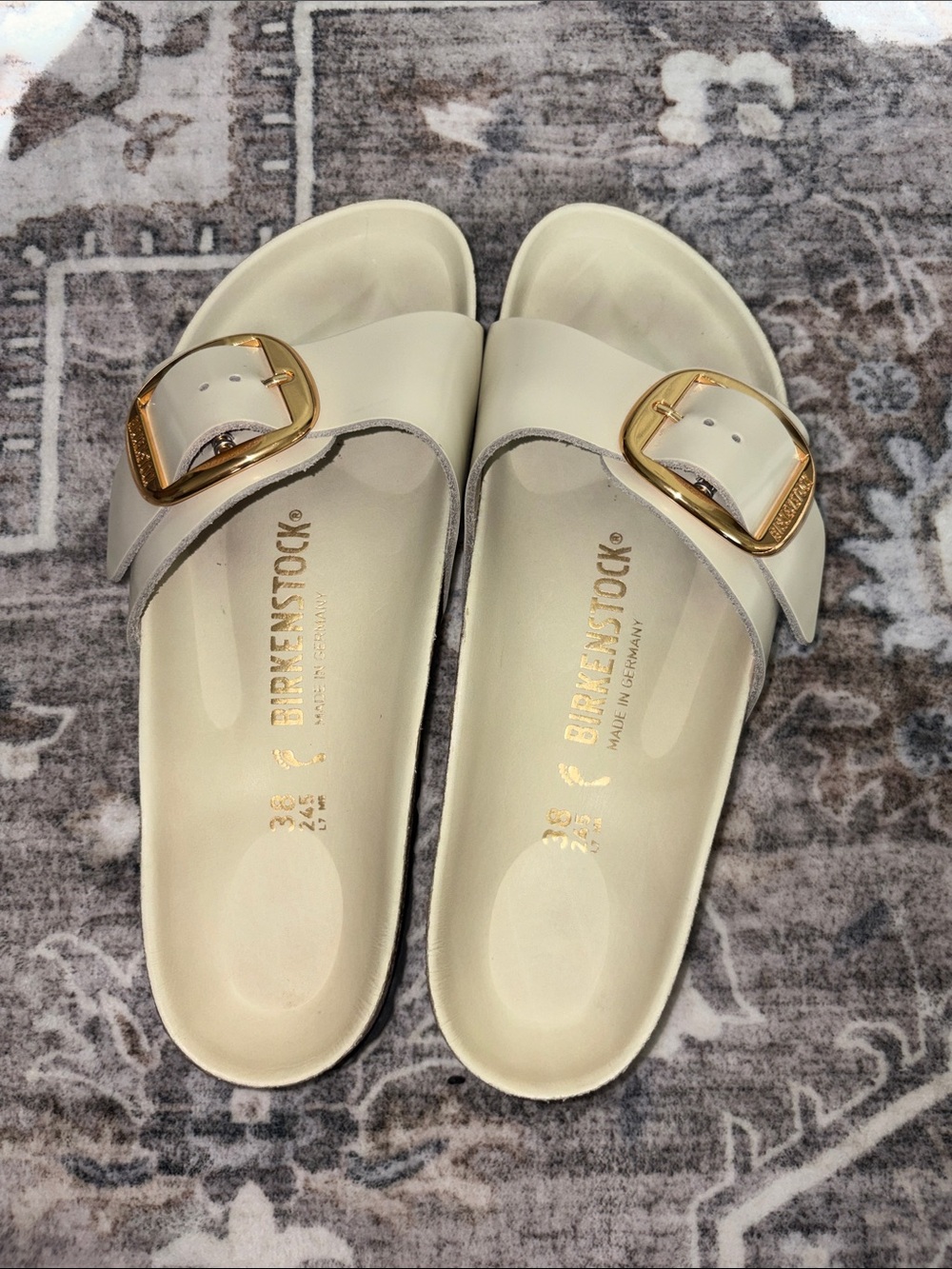 Birkenstock Ivory Slide Sandals with Gold Buckles